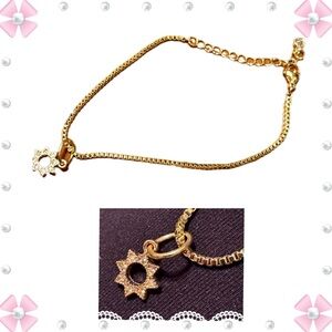 Bracelet - gold tone chain with crystal gem star charm. 9”L. Gently used